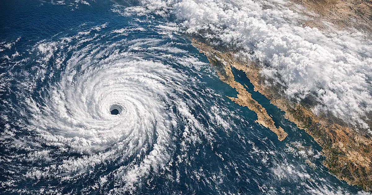 Satellite view of massive hurricane spiral system over Pacific Ocean near Mexican coastline
