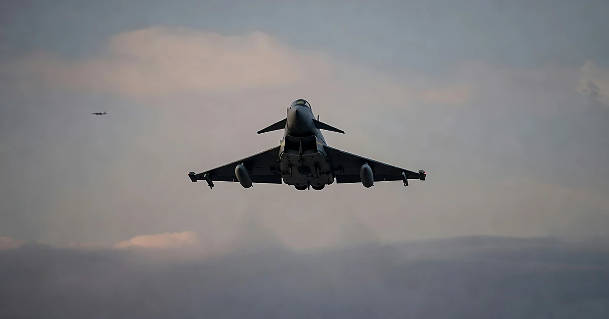 German Eurofighter jet flying through overcast sky during military scramble operation