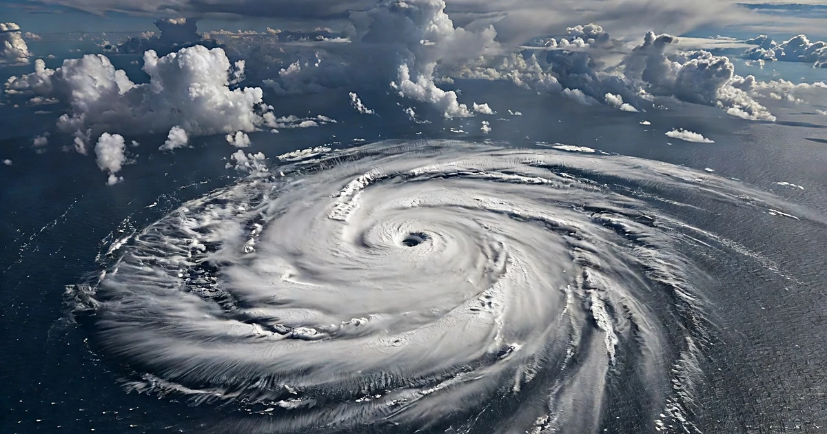 Aerial view of large tropical cyclone system with spiral cloud bands over Pacific Ocean waters