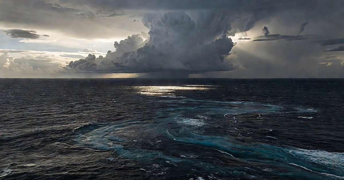 Turbulent Pacific Ocean waters under dramatic storm clouds with visible current patterns and atmospheric instability