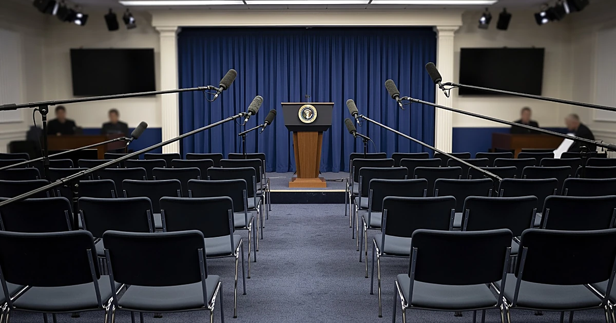 Empty White House press briefing room with podium and microphones awaiting new press secretary
